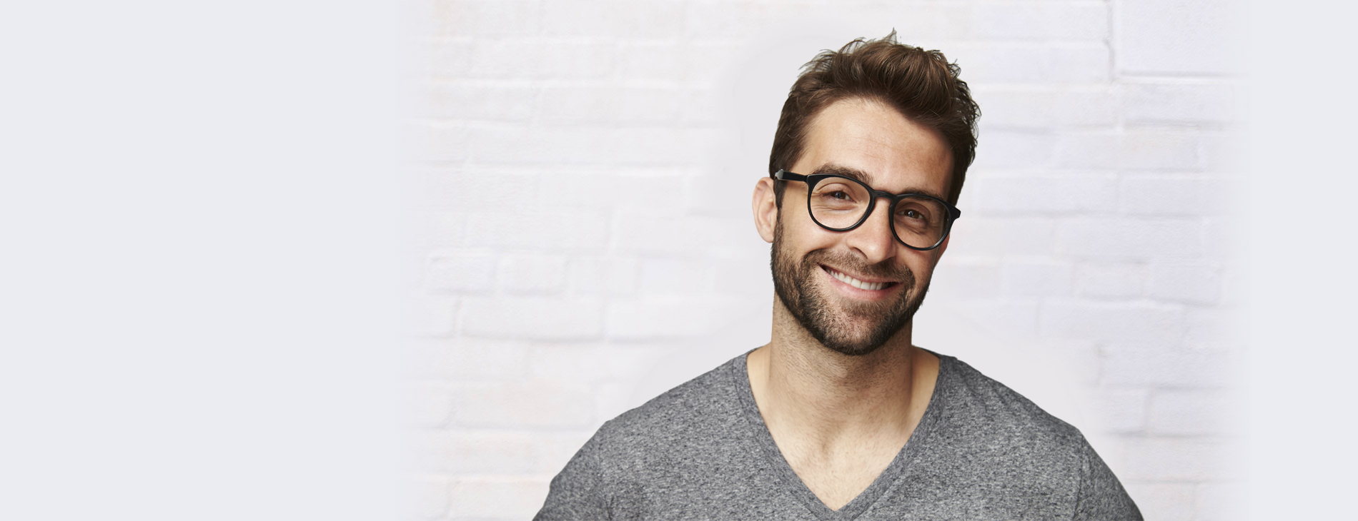 A man smiling and ready embrace the next generation of CRM with one of our tailored solutions